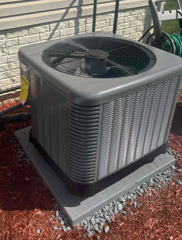 Air conditioner condenser unit outside house