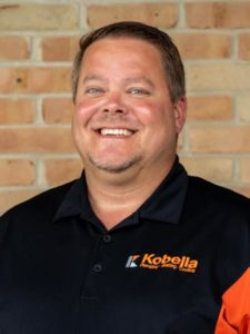 A smiling Kobella employee