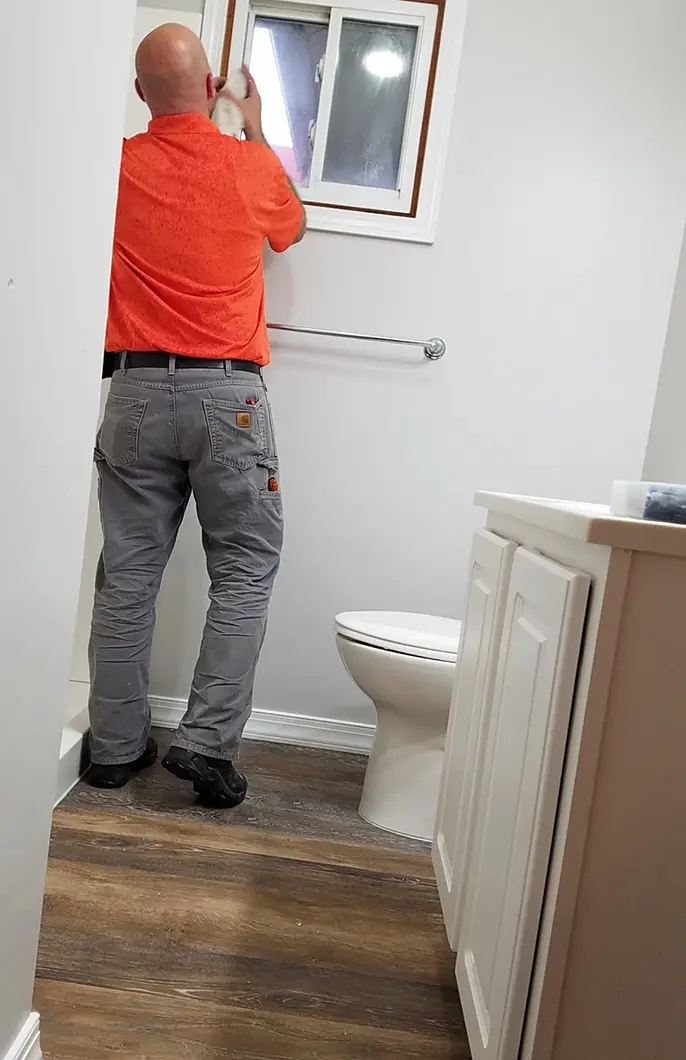 A Kobella technician working on a bathroom renovation