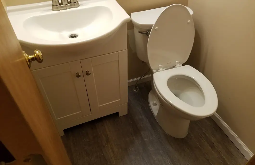 A newly installed bathroom sink and toilet