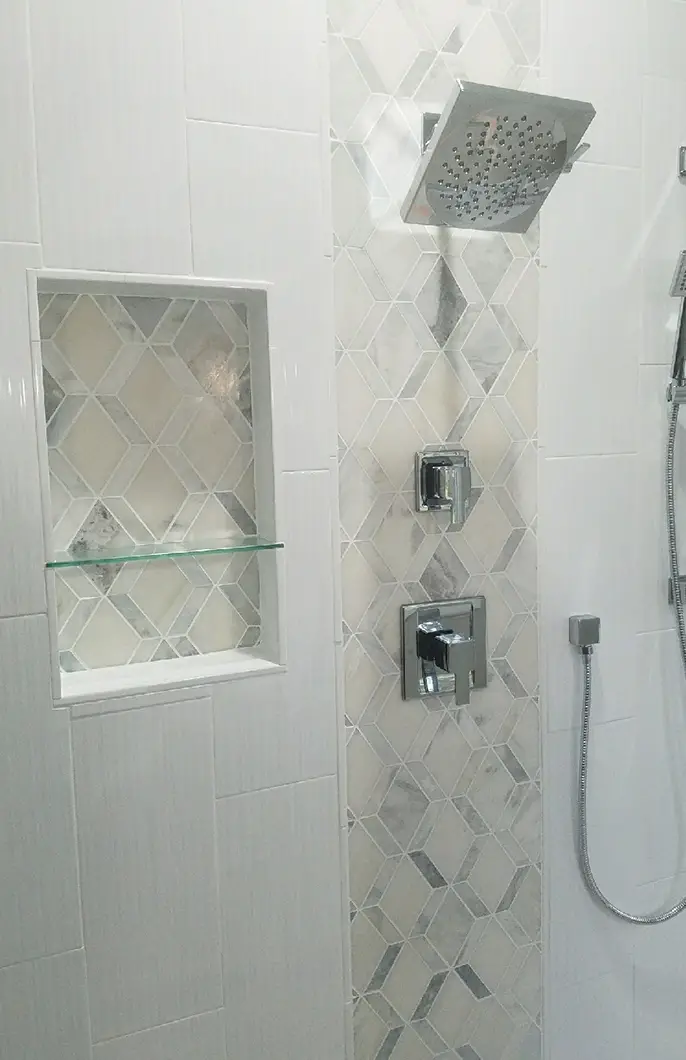 A newly installed shower with a tile backsplash