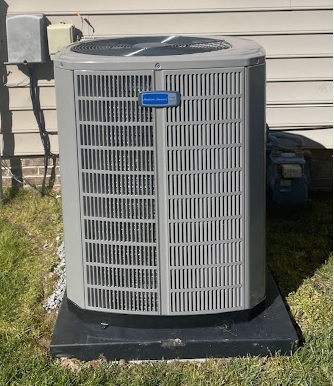 AC condenser unit in yard