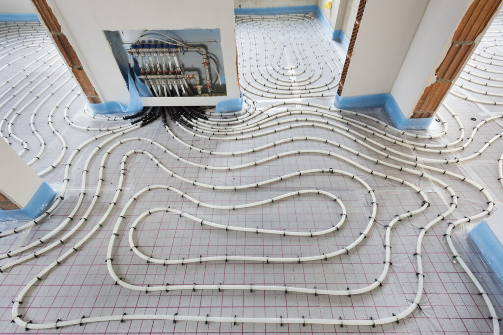 Radiant heating coils set up under floor of home