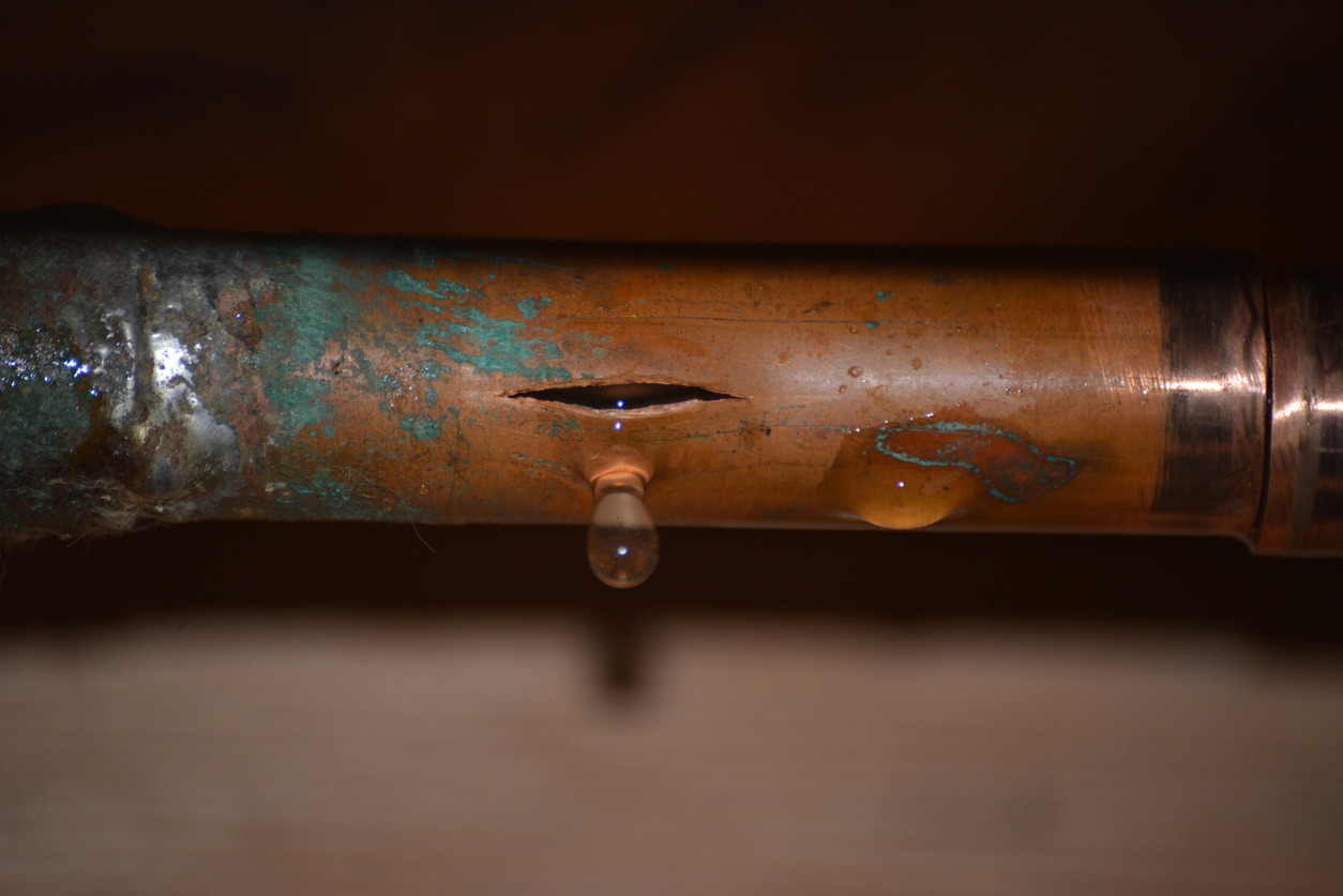 Oxidizing copper pipe with a hole leaking water